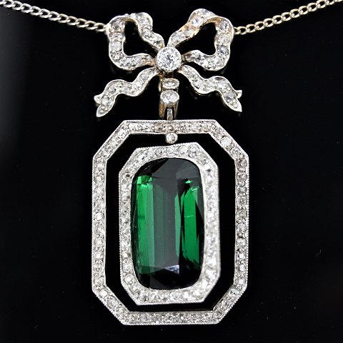 A necklace set with a tourmaline, a brillant and diamonds mounted in gold and white gold