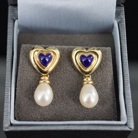 A pair of heart shaped earrings set with lapis lazuli and pearls, mounted in 14k gold