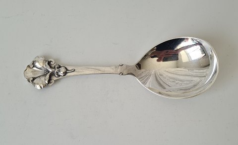 Serving spoon in silver beautifully decorated with flower