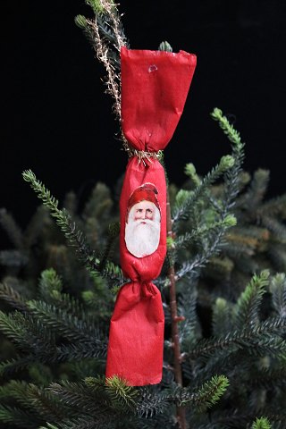 Antique Christmas tree ornament from 1900 in the shape of a Santa Claus hat made 
of scrap paper...