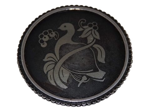Georg Jensen
Dark round  brooch with bird from 1944-1950