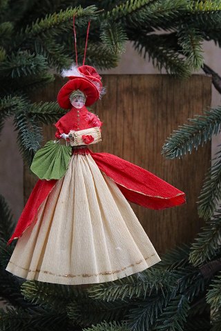 Old Christmas tree ornament, nice lady with sleeve and bag made of colored crepe 
paper...
