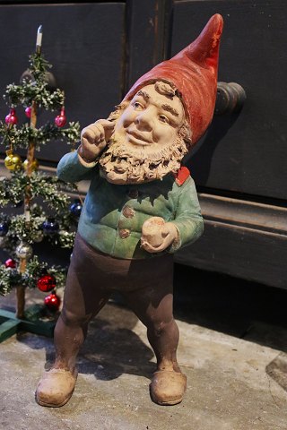 Antique terracotta gnome with old paint and a fine patina...