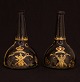 A pair of original decorated bottles. Holland or England circa 1760. H: 22cm
