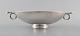 L'Art presents: 
GUSTAV 
PEDERSEN for 
Georg Jensen. 
Large art deco 
bowl with 
handles on foot 
in sterling 
silver.
