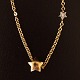 Ole Lynggaard; necklace in 14k gold with star shaped lock and a star shaped pendant with two diamants