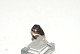 Ladies ring with purple stone in 14 carat gold
Size 60