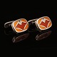 A pair of sterlingsilver and enamel cufflinks by Naja Salto for Georg Jensen. 
#602. Size: 1,6x2,2cm