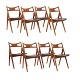 Hans J. Wegner, Denmark, set of eight Sawbuck Chairs CH 29, teak and leather. Signed Hans J. Wegner and Cark Hansen & Søn. Nice condition with signs of use. H: 75cm. H S: 44,5cm