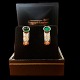 Frantz Hingelberg; Ear rings in 18k gold and white gold set with emerald and diamonds