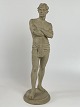 Antique terracotta figure of a standing man with loin cloth. The figure is stamped L. P. Jorgensen (Jørgensen), København (Copenhagen), Eneret (exclusive right). Circa 1890s.