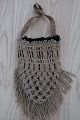 An antique beautiful handbag handmade of flax, and it has the characteristic 
colour of  flax 
The closing is made with a string, handmade as well