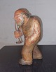 Wooden figure of a man smoking a pipe​