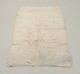 Scandinavian textile designer.Rya carpet in pure wool.