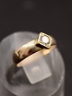 14 karat guldring med 0,15 ct diamant