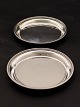 A pair of sterling silver wine trays