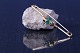 Unique gold brooch in 14 karat gold, with a beautiful green stone. Stamped VW 585