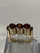 14 karat gold, Ladies ring with 3 Orange stones.
Ring size 52.
