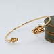 Georg Jensen; A Moonlight Grapes bangle in 18k gold, set with diamonds
