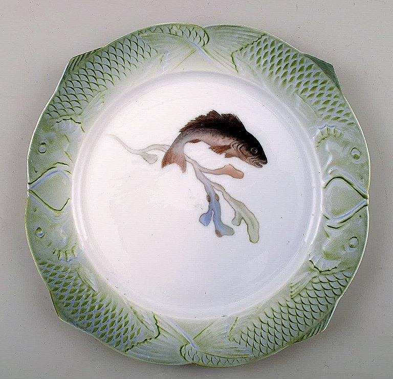 Arnold Krog for Royal Copenhagen: "Fish service" dinner plate in porcelain, decorated in colors with a fish.