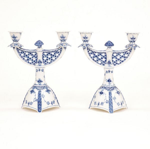 Royal Copenhagen: A pair of blue fluted full lace candelabra 1169. H: 25,5cm. W: 
21cm