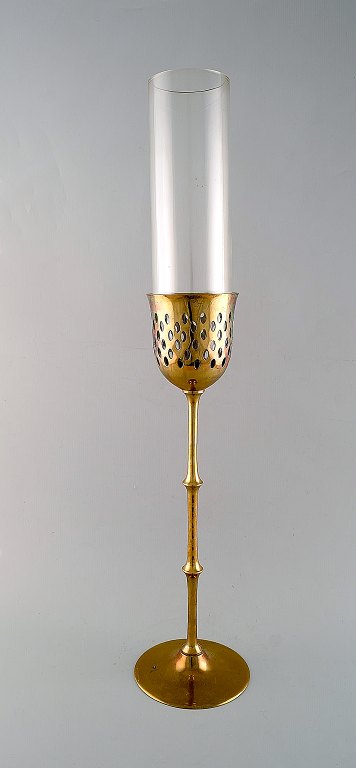 Bjørn Wiinblad (1918-2006). Tall "Hurricane" candle holder in brass with blue tinted glass. 1970