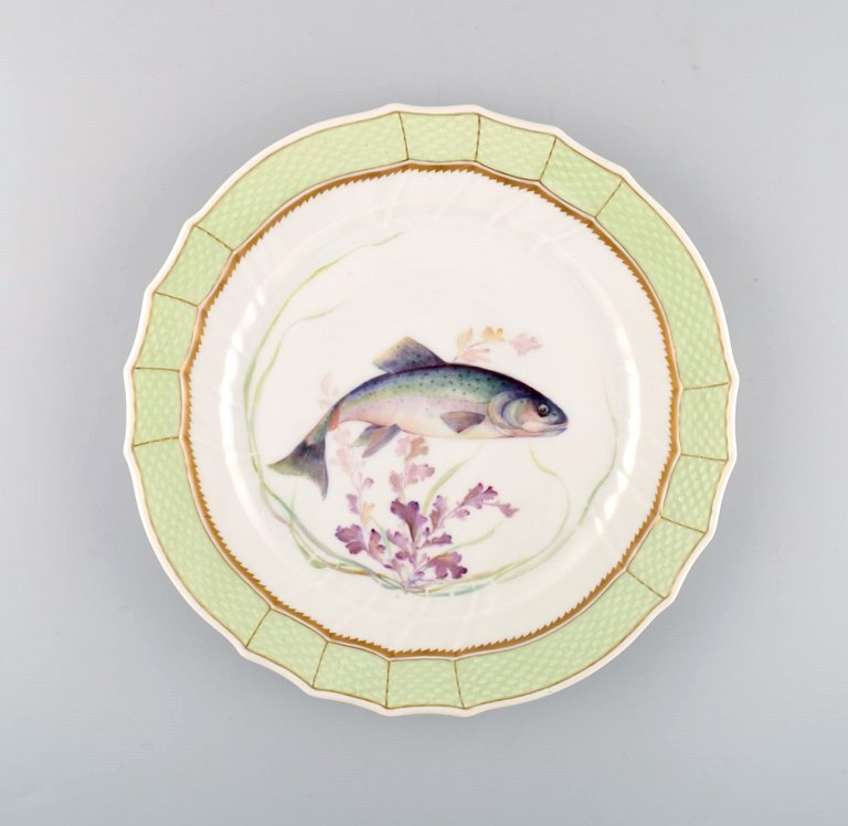 Royal Copenhagen fish plate with green edge, gold decoration and fish motif. Model 919/1710.