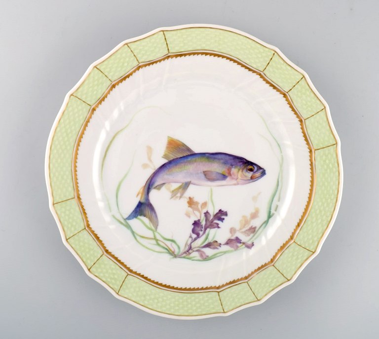 Royal Copenhagen fish plate with green edge, gold decoration and fish motif. Model 919/1710.