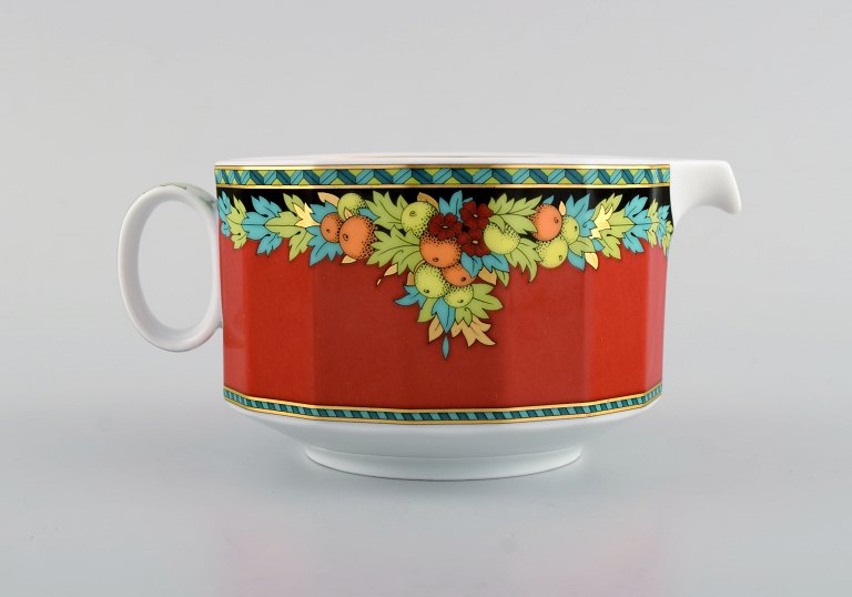 Gianni Versace for Rosenthal. Le Roi Soleil porcelain sauce jug with floral and gold decoration. Late 20th century.