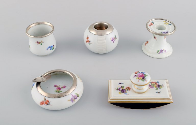 Five parts Meissen porcelain with hand-painted floral motifs, gold decoration and sterling silver fittings. 20th century.