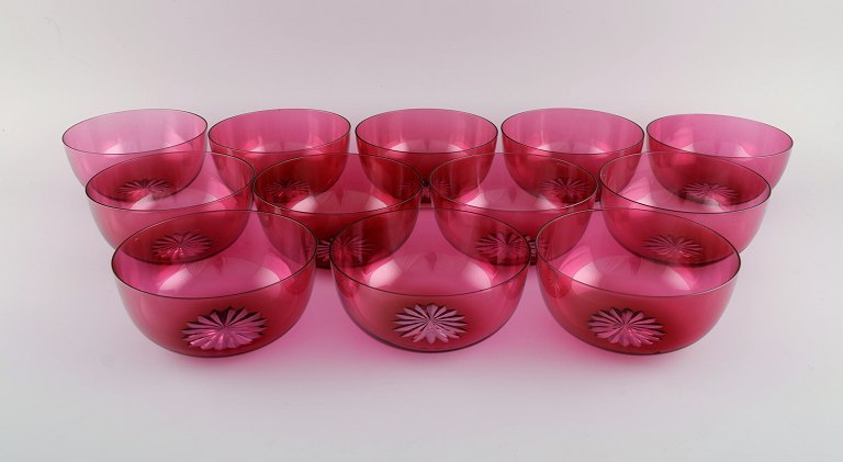 Set of twelve Holmegaard bowls in pink art glass. Danish design, mid-20th century.