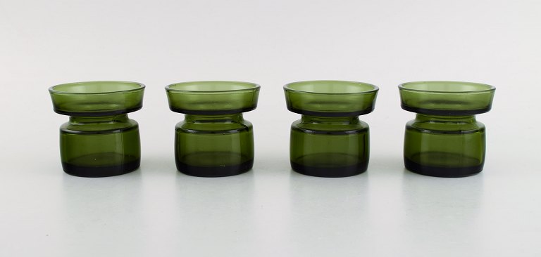 Jens Harald Quistgaard. Fire "Hyggelys" til fyrfadslys i mørkegrønt kunstglas. 
Retro, 1960