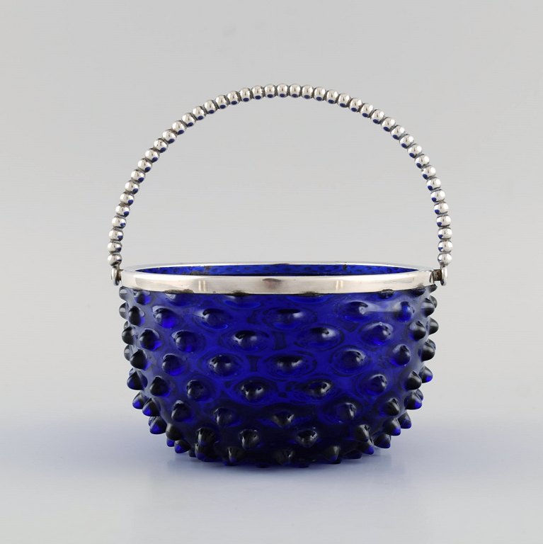 Danish glass art. Bonbonniere in blue mouth-blown art glass with silver mounting and handle. 1920