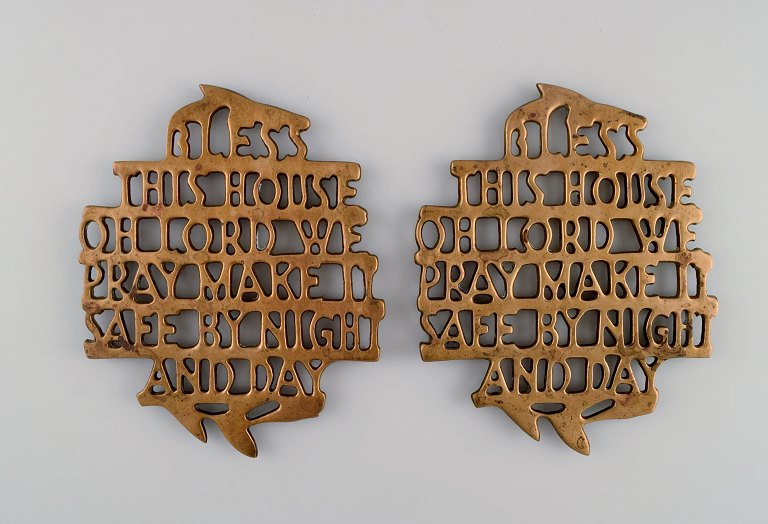 Estrid Ericson for Svenskt Tenn, Stockholm. Two "Bless this house" trivets in brass. Mid-20th century.