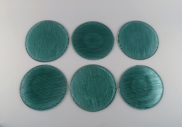 Per Lütken for Holmegaard. Seks "Buffet" tallerkener i blågrønt mundblæst 
kunstglas. 1980