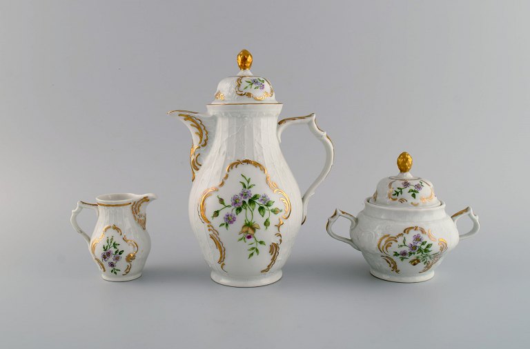 Rosenthal Sans Souci coffee pot, sugar bowl and cream jug. Hand-painted flowers, foliage in relief and gold edge. 1950s.