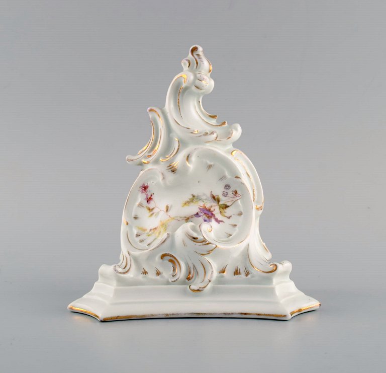 Antique wall console in hand-painted porcelain with flowers and gold decoration. Germany, 19th century.