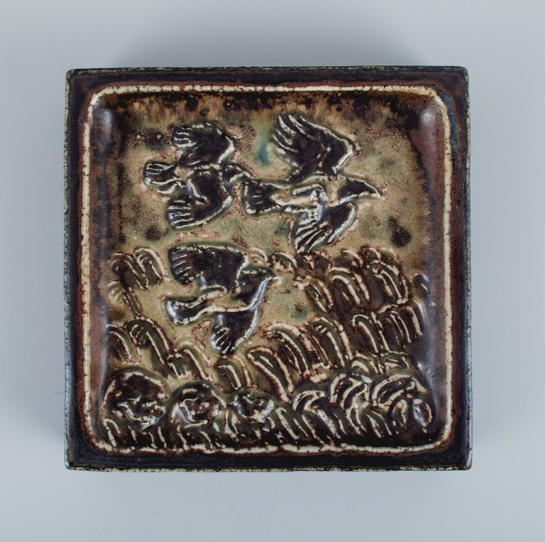 Knud Kyhn for Royal Copehagen.Wall relief in stoneware with a motif of birds in a landscape.