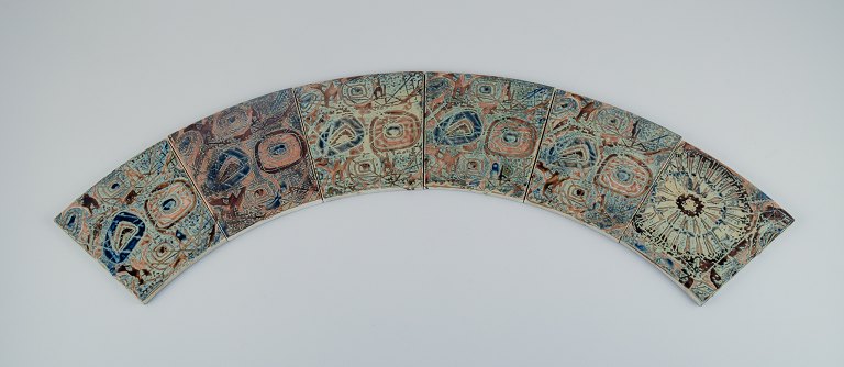 Royal Copenhagen, six Baca faience tiles with patterned glaze in brown, blue and green.