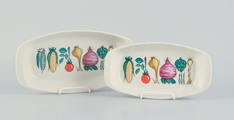Villeroy & Boch, Luxembourg, two "Primabella" retro-style stoneware dishes featuring various vegetable motifs.