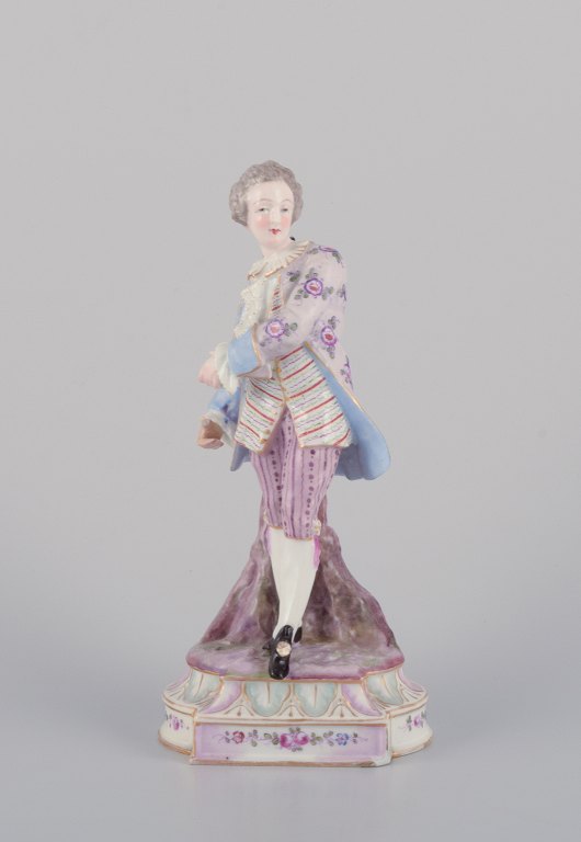 Antique German porcelain figurine. Large figurine of a young man in fine clothes. Hand-painted in polychrome colors.