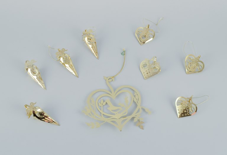 Royal Copenhagen "Royal Christmas". Set of nine brass Christmas ornaments for hanging on the Christmas tree and in the window.