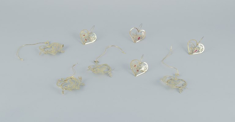 Royal Copenhagen "Royal Christmas". Set of eight brass Christmas ornaments for hanging on the Christmas tree and in the window.