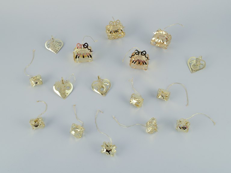 Royal Copenhagen "Royal Christmas". Set of 16 brass Christmas ornaments for hanging on the Christmas tree and in the window.
