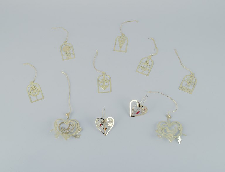 Royal Copenhagen "Royal Christmas". Set of ten brass Christmas ornaments for hanging on the Christmas tree and in the window.
