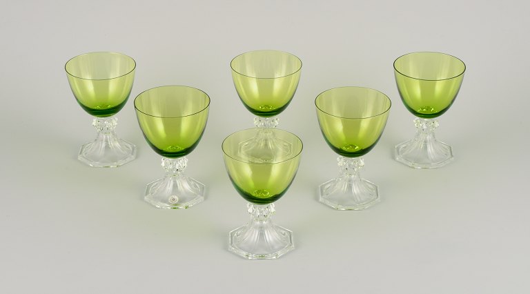 Val St. Lambert, Belgium. A set of six white wine glasses in green and clear mouth-blown crystal glass.