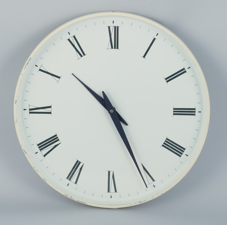 Henning Koppel for Georg Jensen. Wall clock made of white plastic and metal.