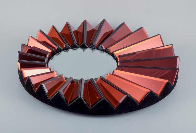 Olivier de Schrijver (1958), French designer. Futuristic "Simba Rouge" unique wall mirror made of copper-colored metallic acrylic glass. Faceted mirror.