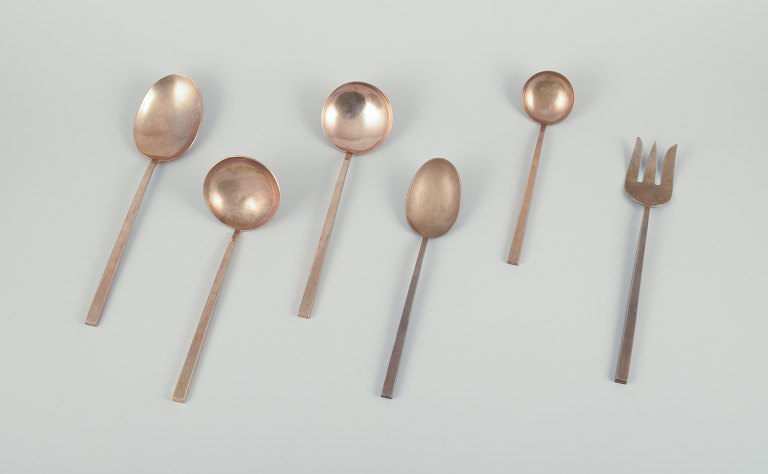 Sigvard Bernadotte "Scanline" brass flatware.  Six pieces of serving utensils.