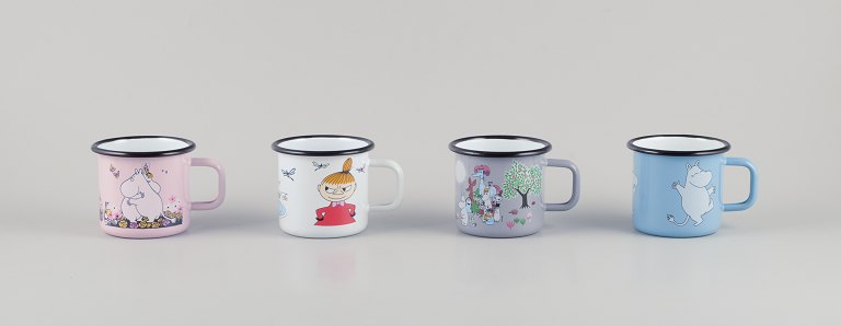 Muurla, Finland. Four enamel mugs with different motifs from the Moomin troll universe.